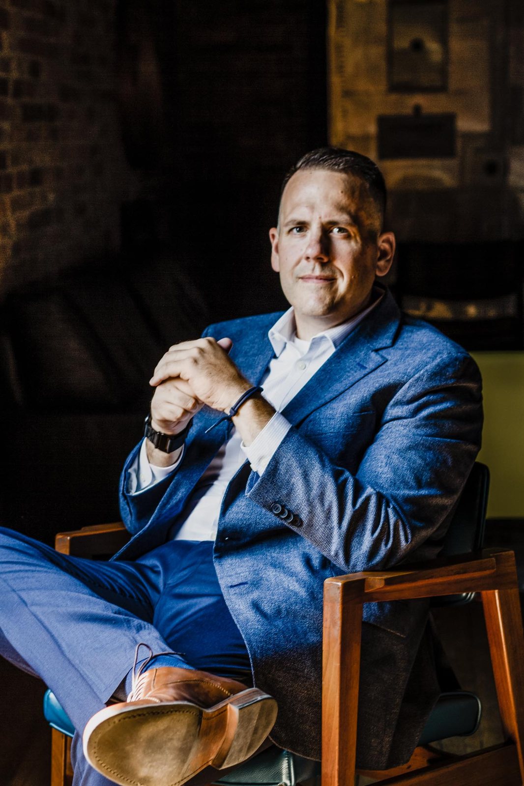 Jake Hamann — Seated, blue blazer